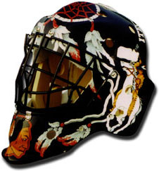 Custom painted goalie mask in a Chicago Blackhawks theme with a dreamcatcher and an American Indian riding a white horse.